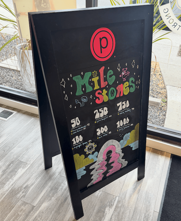 Amanda's featured chalk sign — bold lettering, illustrated detail.